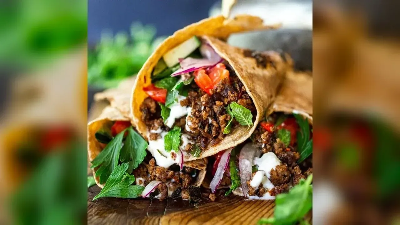 Hot cumin lamb wrap with crunchy slaw & spicy mayo