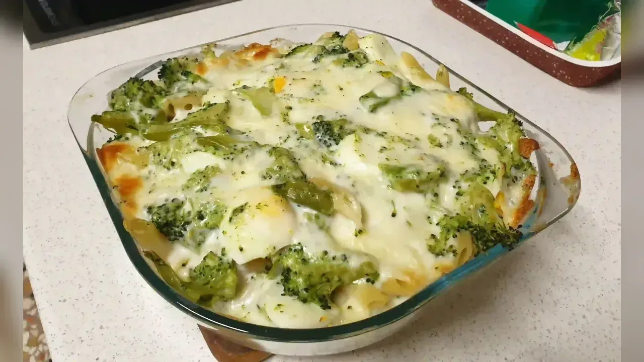 Baked pasta with broccoli, boiled eggs and scamorza cheese